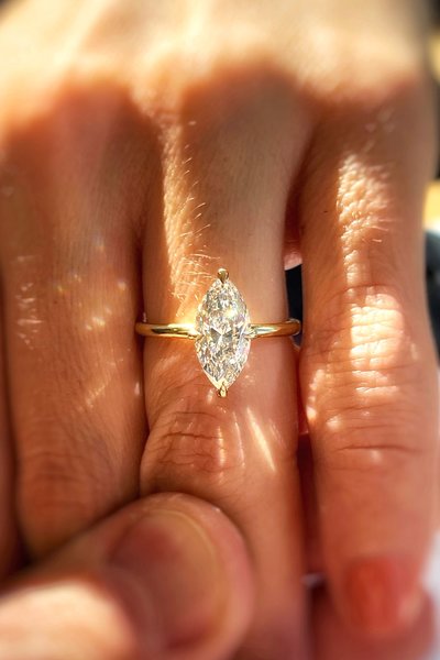 Molly and Andrew's 18k Yellow Gold Classic Solitaire with a Brilliant Marquise